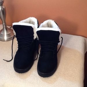 Black suede boots, never worn, lace up front.
